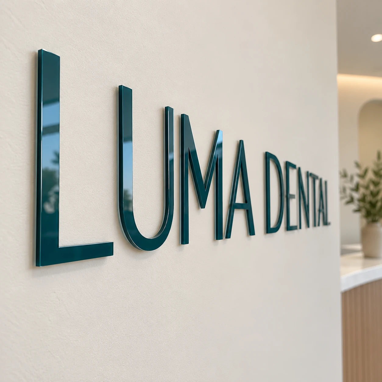 Opaque gloss white and black acrylic letters bonded to a wall.